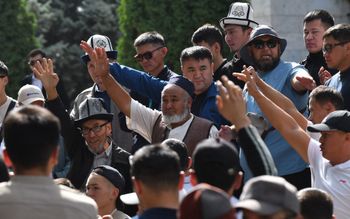 Protesters hold a rally to demand that authorities support residents of Kyrgyzstan's southern Batken province following border clashes with Tajik troops, near the Kyrgyz parliament in Bishkek on September 16, 2022.