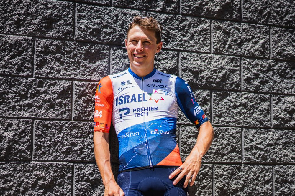 Israel Premier Tech cyclist Corbin Strong wearing the new jersey symbolizing Israeli landscape.