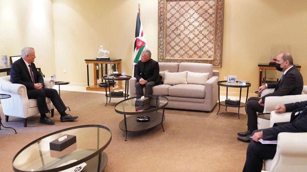 Jordan's King Abdullah II (C), accompanied by Foreign Minister Ayman Safadi (R), meeting with Israeli Defense Minister Benny Gantz (L) in the capital Amman on January 5, 2022.