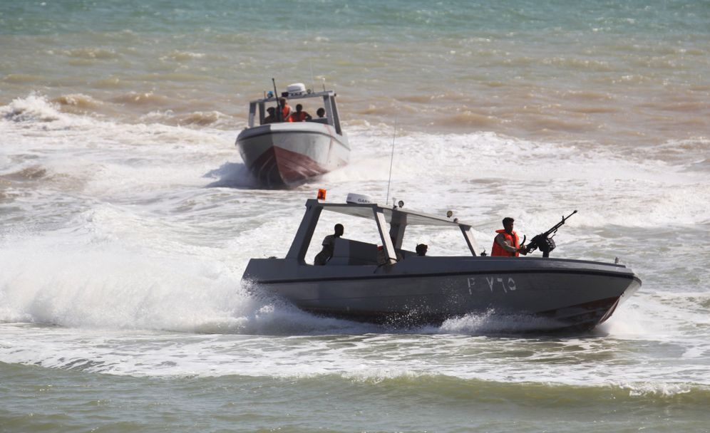 Yemen Coast Guard sailors take part in a military ceremony in Mukalla, Yemen
