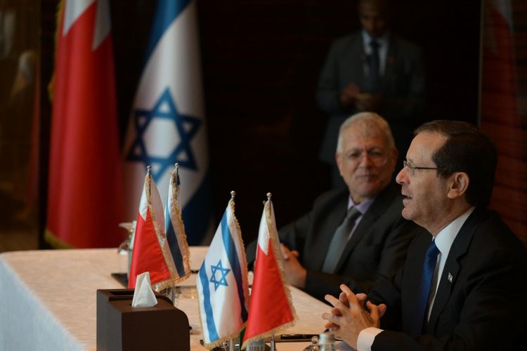 Israel's President Isaac Herzog (R) meets with representatives from Bahrain's Jewish community, Bahrain, December 4, 2022.