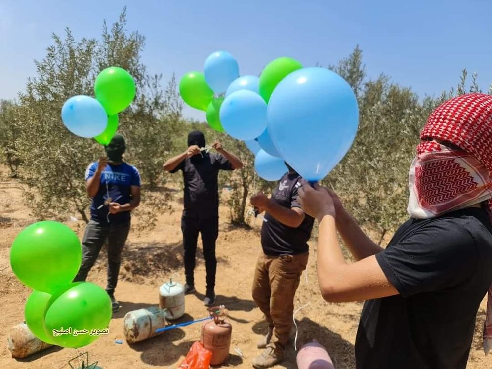 Picture courtesy of Matthias Inbar Members of the Hamas terrorist organization in the Gaza Strip prepare to launch incendiary balloons into Israeli territory.