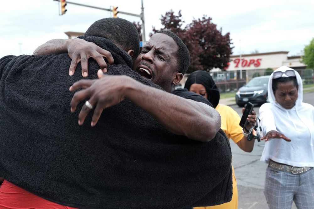 Evangelist Bruce Warrick performs a baptism outside of Tops grocery store on May 20, 2022 in Buffalo, New York, United States.