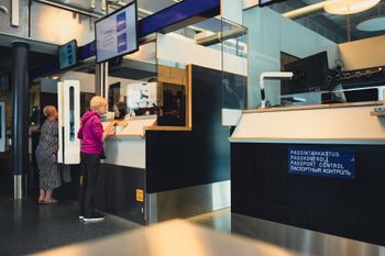 Russian tourists having their passports checked at the Nuijamaa border crossing, Finland, on July 28, 2022.