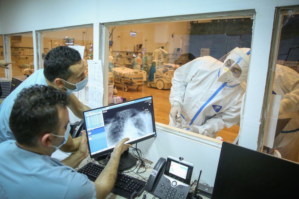 Ziv hospital team members work at the coronavirus ward of the Ziv medical center in the northern Israeli city of Tzfat.