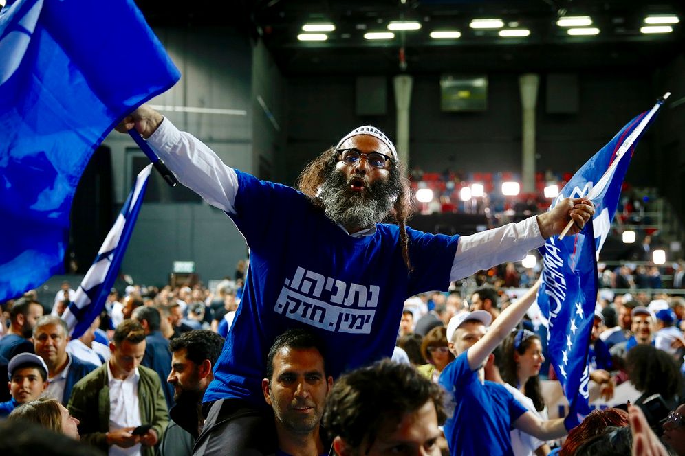 FILE - Likud party supporters cheer at the party's campaign headquarters after polls for Israel's general elections closed in Tel Aviv, Israel, Wednesday, April 10, 2019
