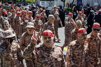 Members of Iran's Basij paramilitary forces march during a rally marking Al-Quds Day, in Tehran on April 14, 2023.