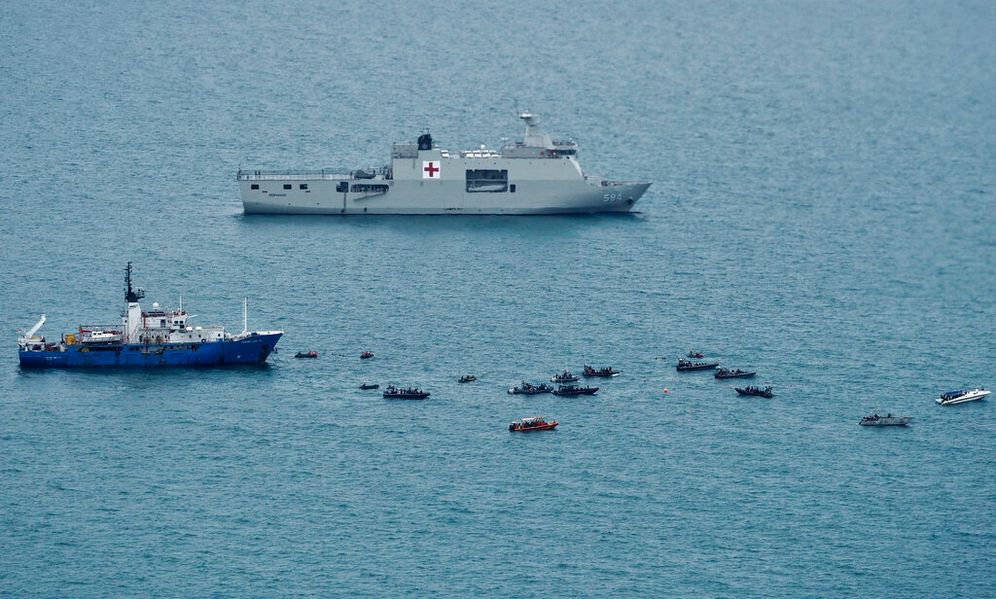 (AP Photo/Eric Ireng) Rescue boats are seen on the Java Sea as the search for the wreckage of the Sriwijaya Air flight that crashed on Saturday continues in this aerial shot taken from an Indonesian Navy aircraft, near Jakarta, Indonesia, Thursday, Jan. 14, 2021