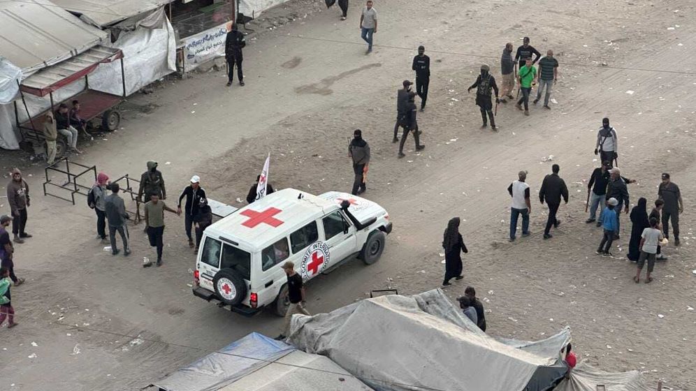 Red Cross vehicles waiting for instructions from Hamas as to where to go to pick up the hostages