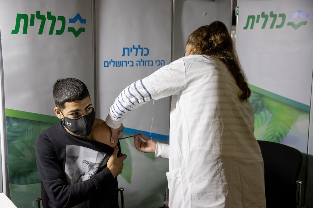 Israeli administered a Covid-19 vaccine dose by a nurse at a Clalit vaccination center in Jerusalem, on March 11, 2021.