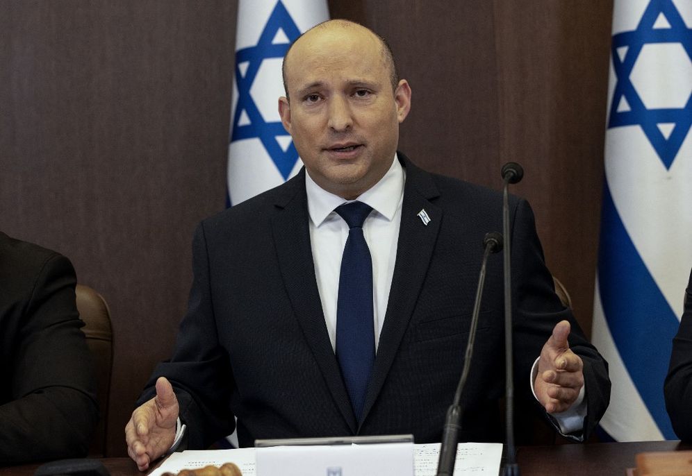 Israel's Prime Minister Naftali Bennett (C) chairs the weekly cabinet meeting in Jerusalem, on December 12, 2021.