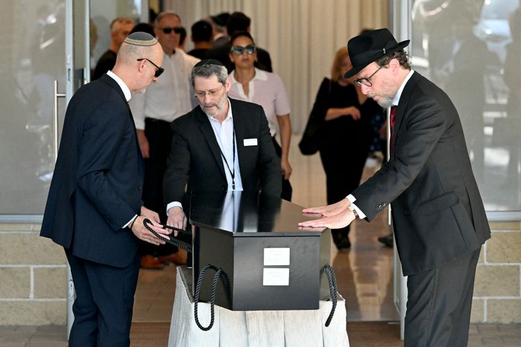 The coffin of Yaakov Levitan, who was killed in the December 14 Bondi beach shooting attack, arrives at the Macquarie Park Cemetery in Sydney on December 17, 2025