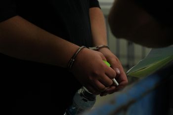 File photo of a suspect in Israel Police custody