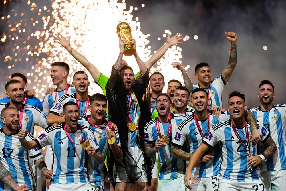 Argentina's Lionel Messi lifts the trophy after winning the World Cup in Lusail, Qatar.