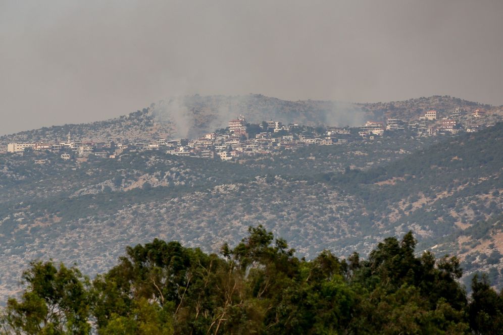 Smoke rises from Kfar Shuba village in the Lebanese side as seen from the Israeli side of the border, on July 27, 2020.