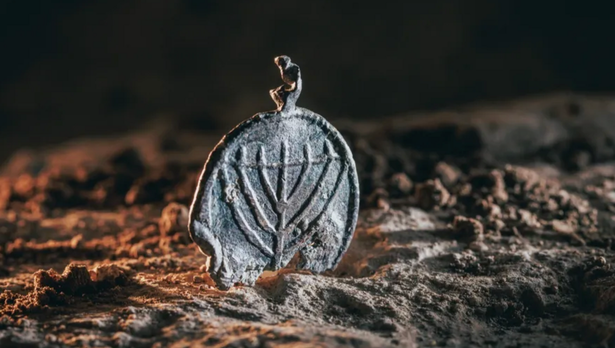 Ancient Menorah Pendant Discovered Near Western Wall