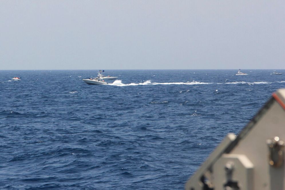 US Navy via AP An Iranian Navy speedboat equipped with machine guns sailing near US warships transiting the Strait of Hormuz, on May 10, 2021.