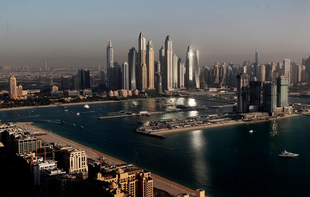 FILE - Luxury towers that dominate the skyline in the Dubai Marina district, center, and the new Dubai Harbor development, right, are seen from the observation deck of "The View at The Palm Jumeirah" in Dubai, United Arab Emirates.