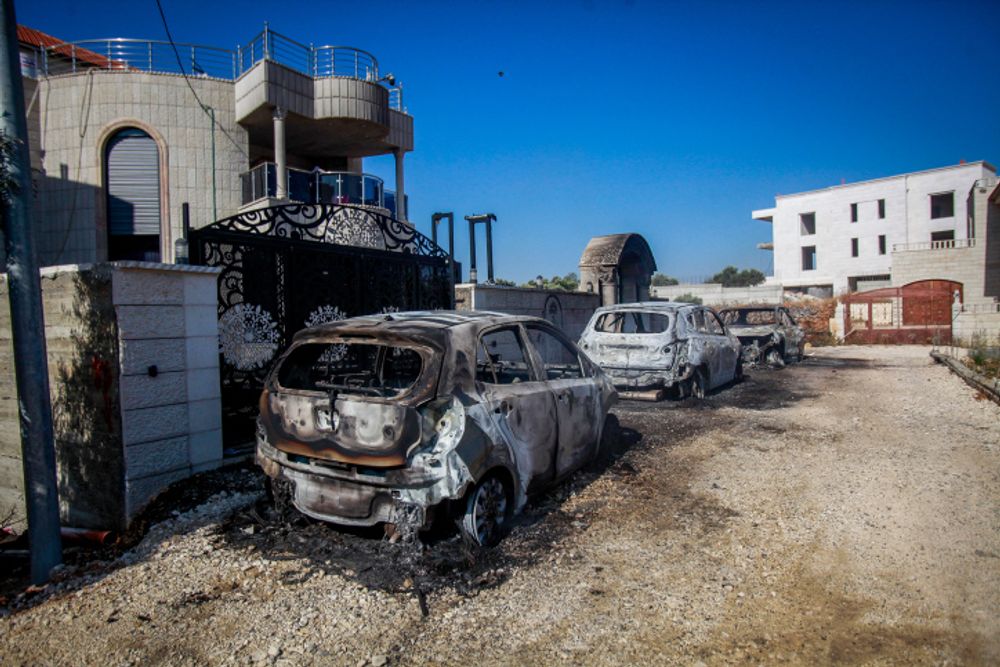 Damage caused to Palestinian homes and cars by Jewish settlers in the West Bank village of Turmus Aya.