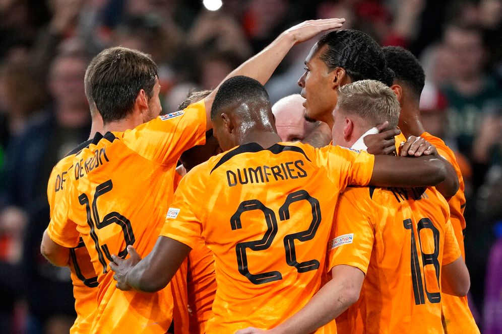 AP Photo/Peter Dejong The Netherlands' Virgil van Dijk celebrates with teammates after scoring his sides first goal during the UEFA Nations League.