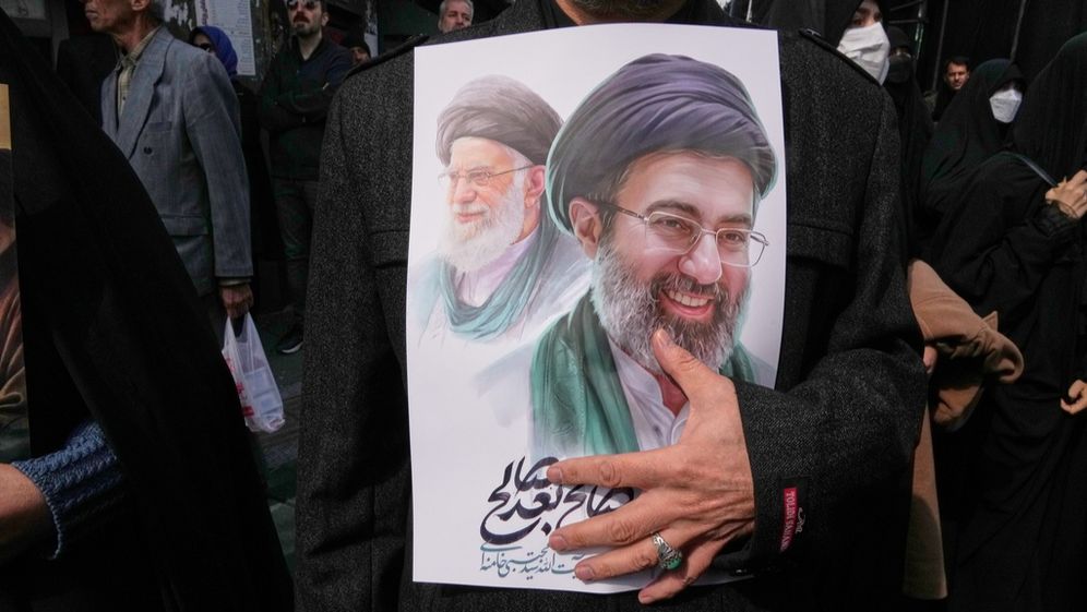 Poster depicting Mojtaba Khamenei, on the right, successor of his father, Ali Khamenei, on the left, during the funerals of high-ranking Iranian military officials killed in Israeli-American strikes, in Tehran, on 03/11/2026