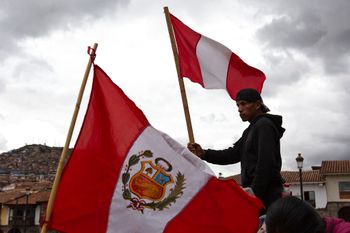 A person waves a Peruvian flag during an anti-government protest in Cusco, Peru, on January 19, 2023.
