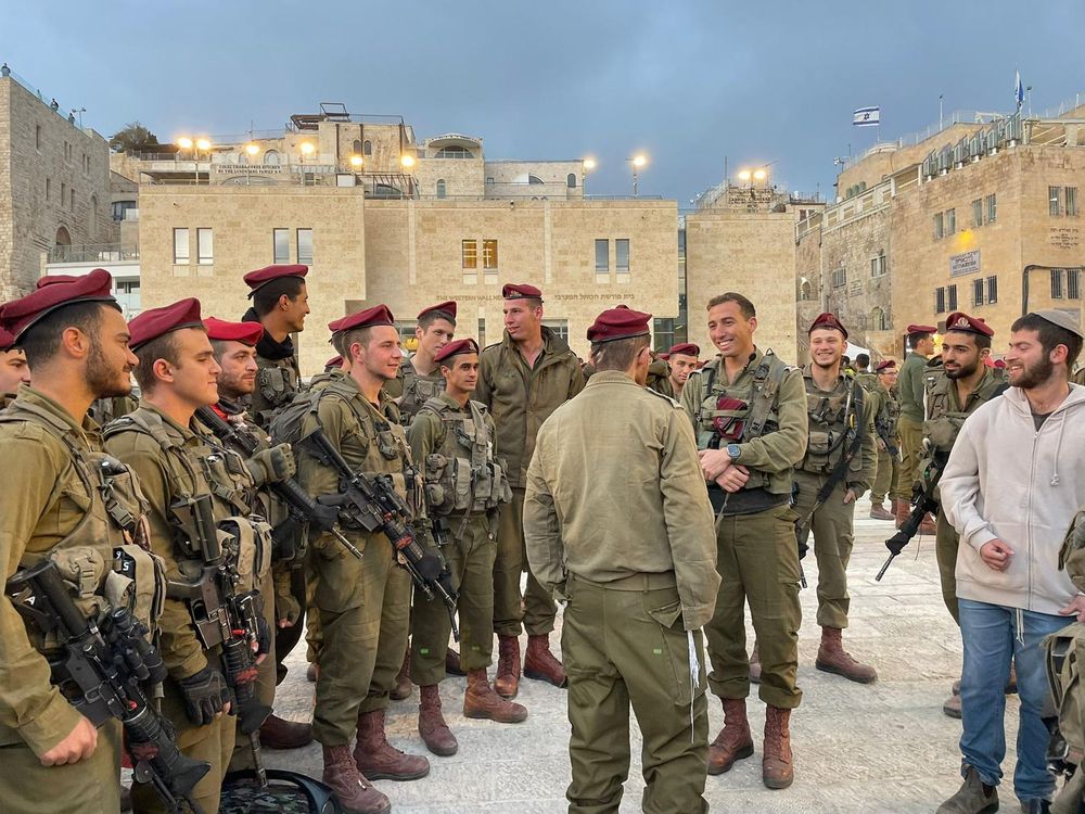 Lieutenant Nadav greeted by Israeli soldiers.