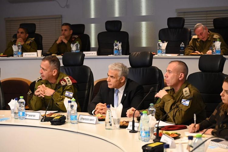 Israel's Prime Minister Yair Lapid (C) during a West Bank security assessment, December 4, 2022.