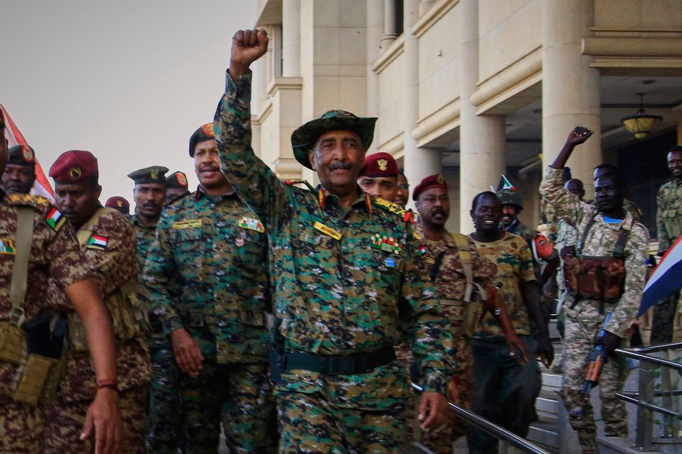 (AP Photo/File) Sudan's military chief Gen. Abdel-Fattah Burhan, center, is greeted by troops as he arrives at the Republican Palace, recently recaptured from the Rapid Support Forces (RSF) paramilitary group, in Khartoum, Sudan, March 26, 2025.