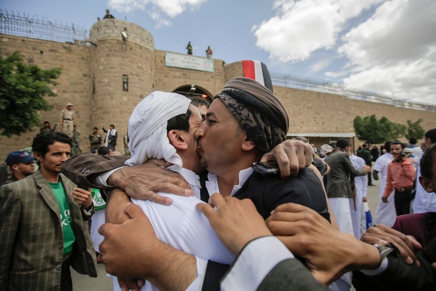 A Yemeni detainee is greeted by his relative after his release from a prison controlled by Houthi rebels, in Sanaa, Yemen, Monday, Sept. 30, 2019