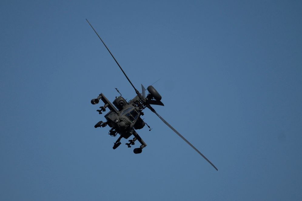 An Apache helicopter flies as soldiers take part in the U.S.-led Immediate Response 25 military exercise in Petrochori, northern Greece Wednesday, June 4, 2025