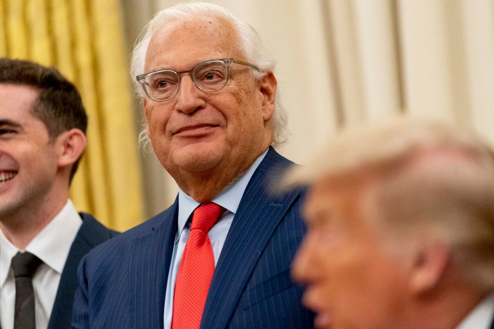 President Donald Trump, foreground, accompanied by U.S. Ambassador to Israel David Friedman, center, speaks in the Oval Office at the White House, Wednesday, Aug. 12, 2020, in Washington