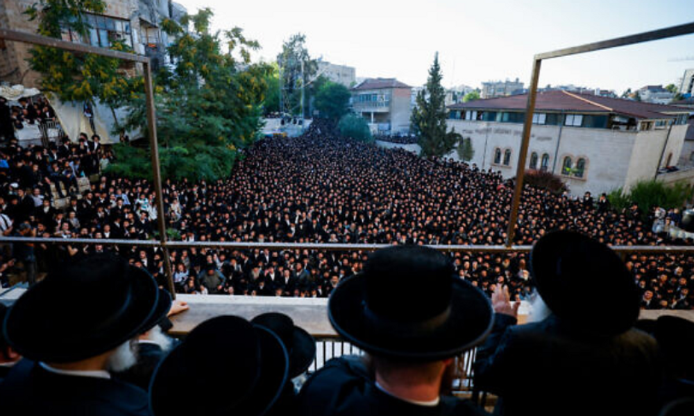 Thousands of Haredim take part in a rally against the recruitment of ultra-Orthodox men into the IDF, in Mea Shearim, Jerusalem, June 30, 2024.