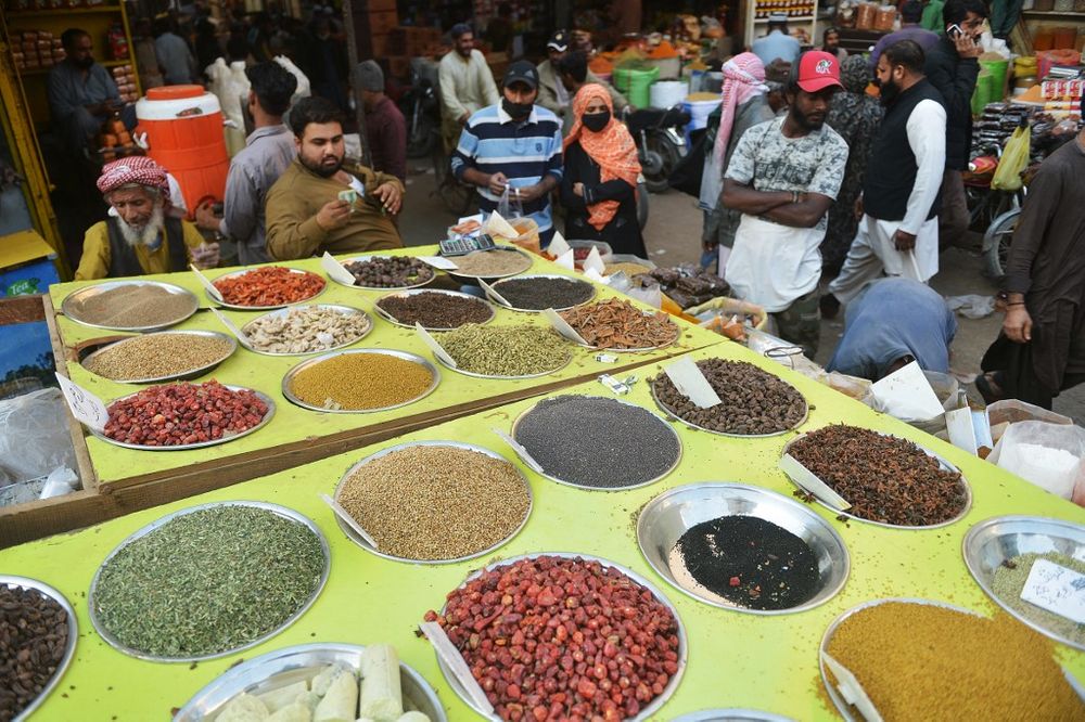 Illustrative: People buy spices at a wholesale market