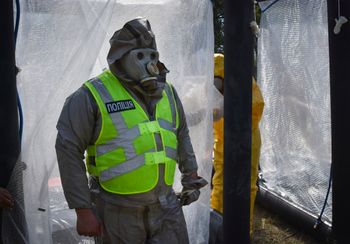 Ukrainian emergency workers wearing radiation protection suits attend training in Zaporizhzhia, Ukraine.