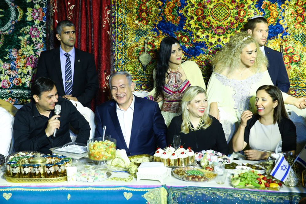 Israeli Prime Minister Benjamin Netanyahu (C-L) at a Mimouna celebration in Yavne, Israel.