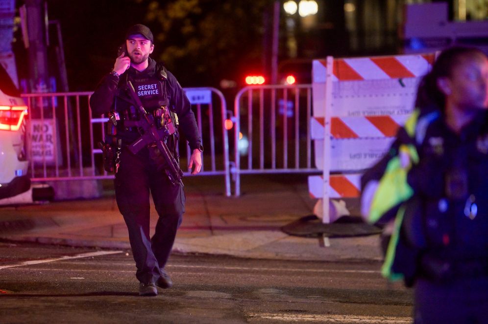 Members of the US Secret Service and local police work to contain the scene outside the White House Correspondents' Dinner, during a shooting inside the Washington Hilton, Saturday, April 25, 2026, in Washington