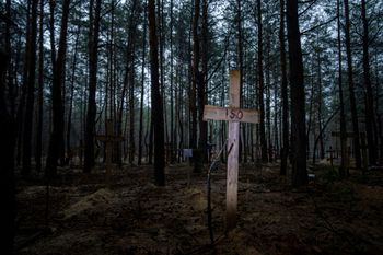 Unidentified graves of civilians and Ukrainian soldiers in a cemetery in the recently retaken area of Izyum, Ukraine, on September 15, 2022.
