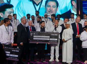CyTaka CEO Doron Amir (speaking) and Mohamad al-Kuwaiti of the UAE government, present a check to a winner at the World Cyber Championship, UAE.