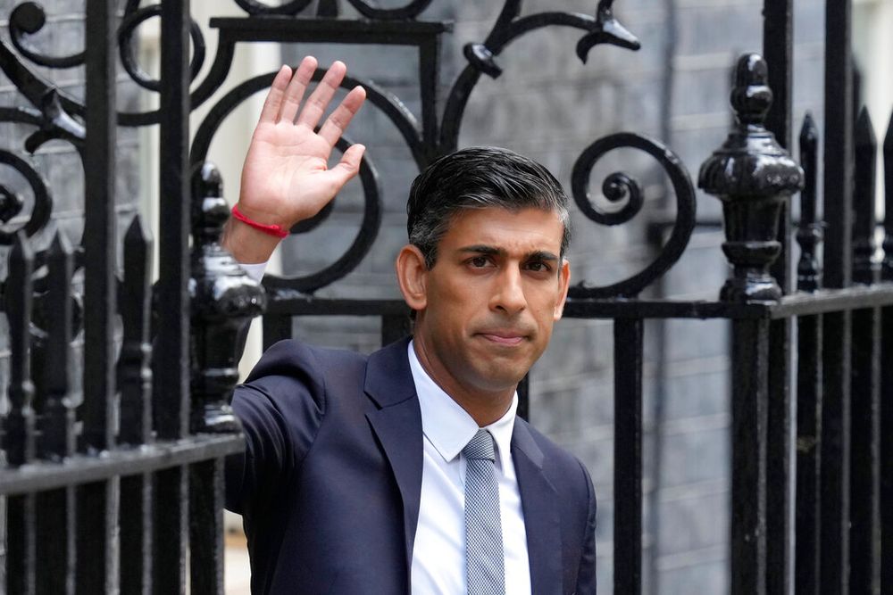 British Prime Minister Rishi Sunak waves after delivering a speech at 10 Downing Street in London, England, on October 25, 2022.