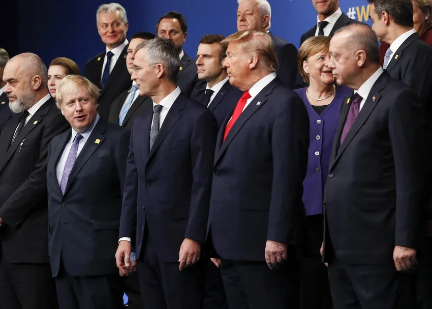 US President Donald Trump and Turkey's President Recep Tayyip Erdogan gather with other NATO leaders for the family photo at the NATO summit at the Grove hotel in Watford, northeast of London on December 4, 2019.