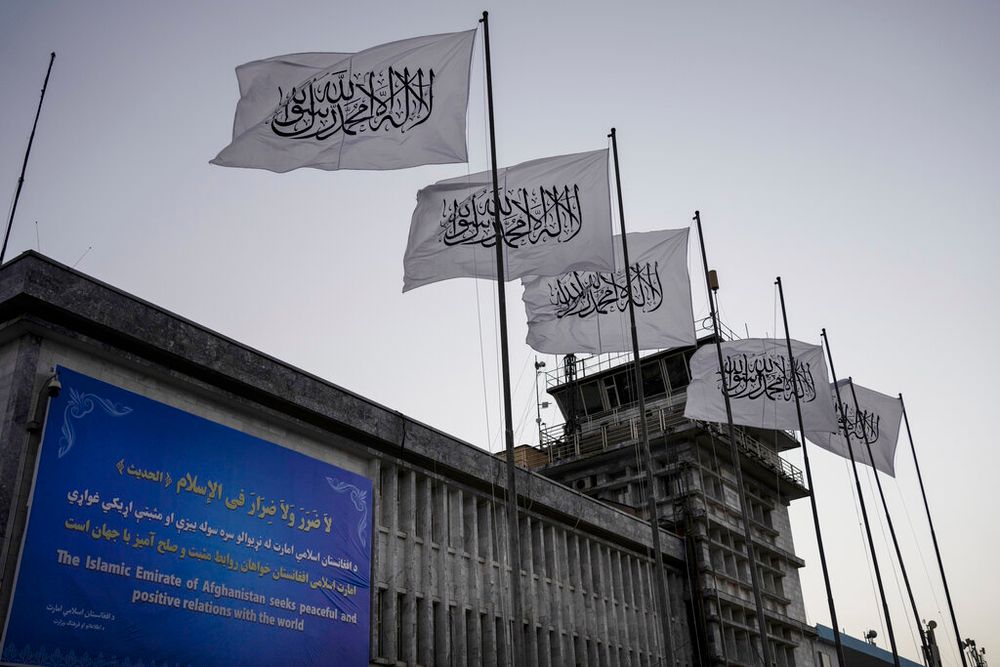 Taliban flags fly at the airport in Kabul, Afghanistan.