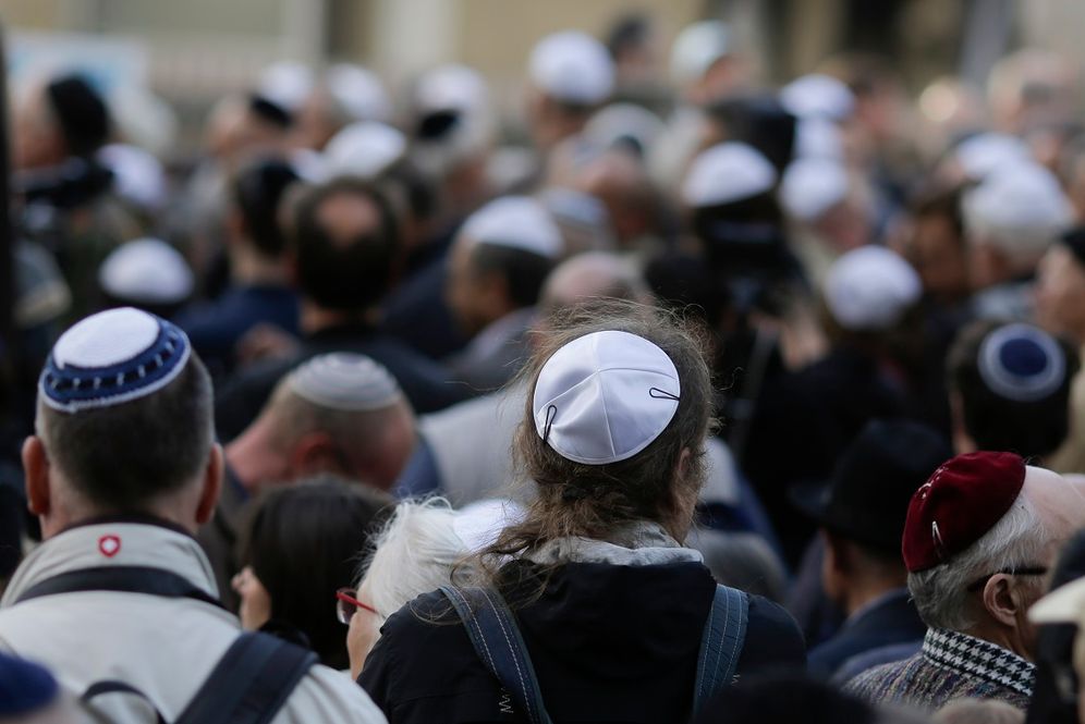 FILE - People wear Jewish skullcaps, or kippas, as they attend a demonstration against an anti-Semitic attack in Berlin, Germany, on April 25, 2018.