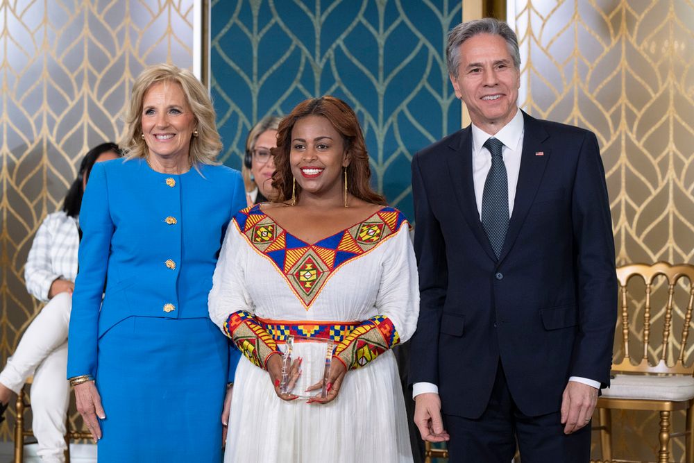 Ethiopian journalist Meaza Mohammed (C) receives an award from U.S. Secretary of State Antony Blinken (R) and first lady Jill Biden in Washington, United States.