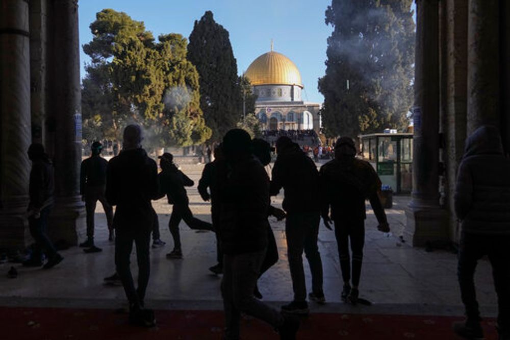 Palestinians clash with Israeli security forces at the al-Aqsa Mosque compound in Jerusalem's Old City, on April 15, 2022.