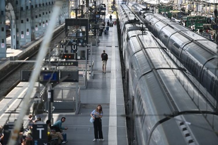 Passengers wait for their train departures on the platform at the Bordeaux-Saint-Jean train station in Bordeaux, western France on July 26, 2024