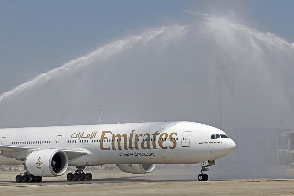 Emirates Boeing 777-300ER aircraft is given a welcoming water salute upon landing at Israel's Ben Gurion Airport in Lod on June 23, 2022, marking the airline's first passenger flight from the United Arab Emirates to Israel.