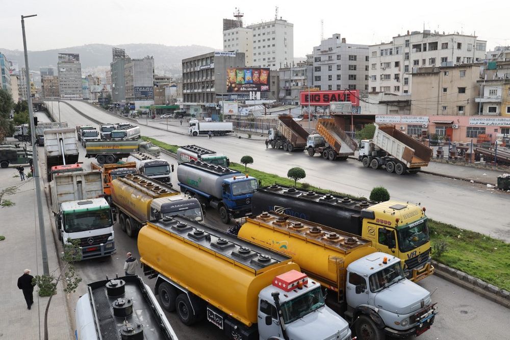 Fuel tankers block a road in Lebanon's capital Beirut during a general strike by public transport and workers unions over the country's economic crisis, on January 13, 2022.