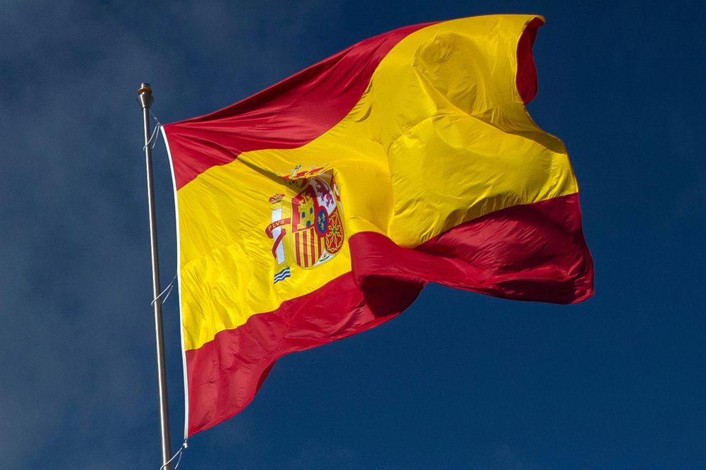 FILE - The Spanish flag flies in Madrid, Spain, Friday, Oct. 23, 2020
