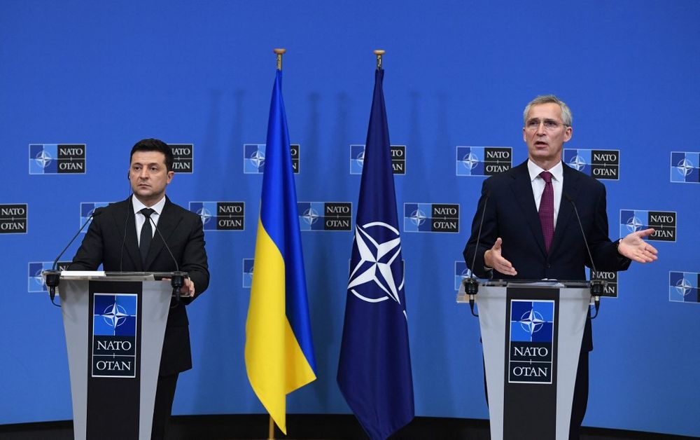 Ukraine's President Volodymyr Zelensky (L) and NATO Secretary General Jens Stoltenberg talk during a press conference at the European Union headquarters in Brussels, Belgium, on December 16, 2021.